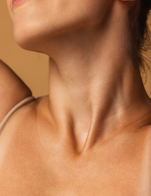 Close up female neck, collarbones isolated on pink studio background. Beautiful caucasian woman with well-kept skin. Natural beauty, fitness, diet, spa, plastic surgery and aesthetic cosmetology concept.