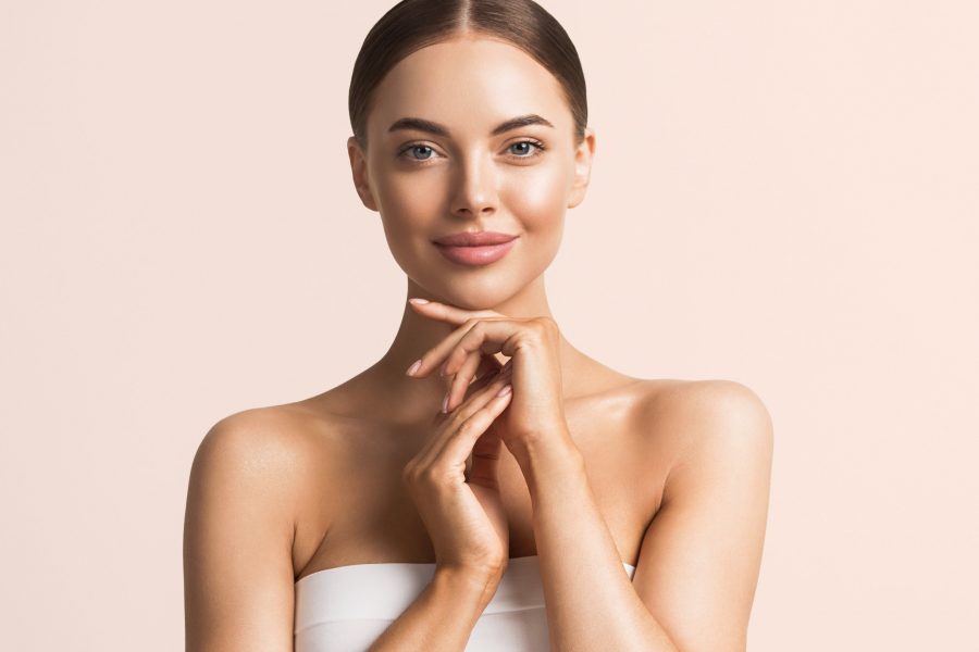 Healthy skin woman natural makeup beauty face closeup with hands