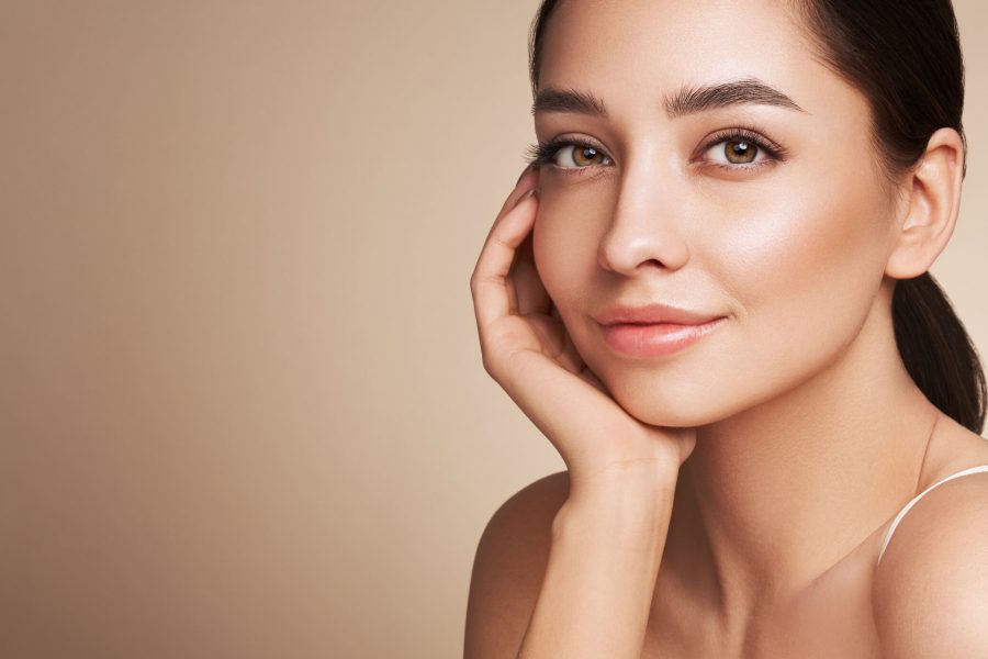 Portrait beautiful young woman with clean fresh skin. Model with healthy skin, close up portrait. Cosmetology, beauty and spa